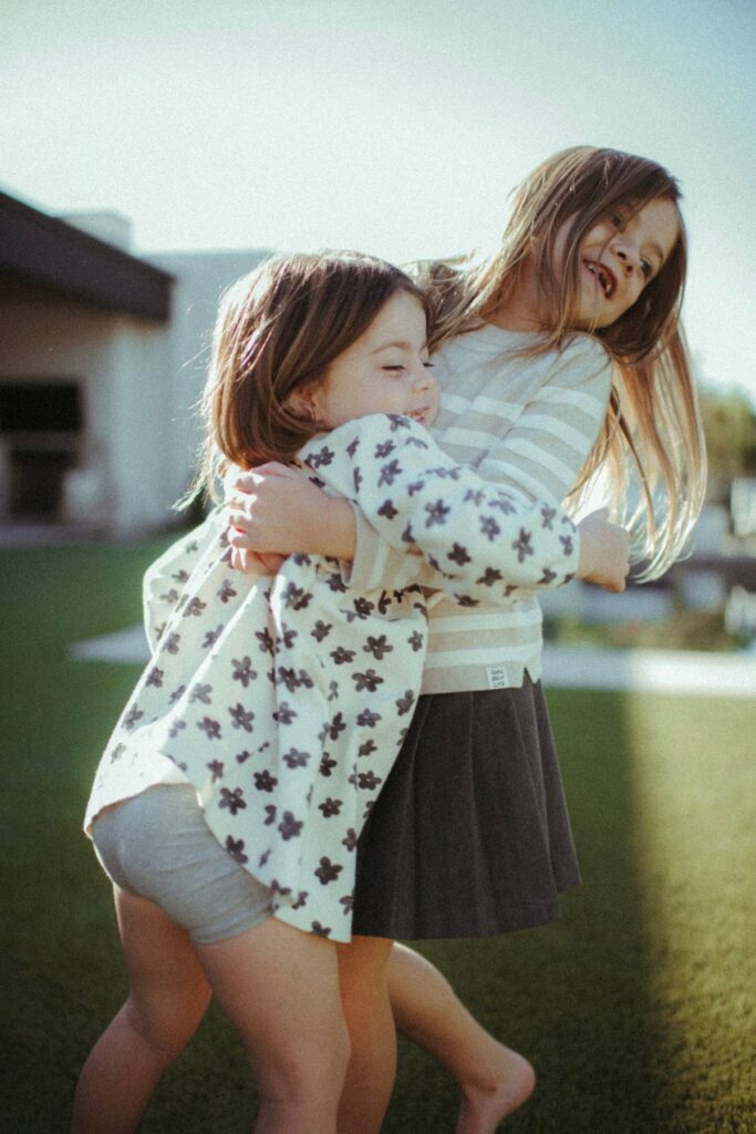 two sisters hugging 