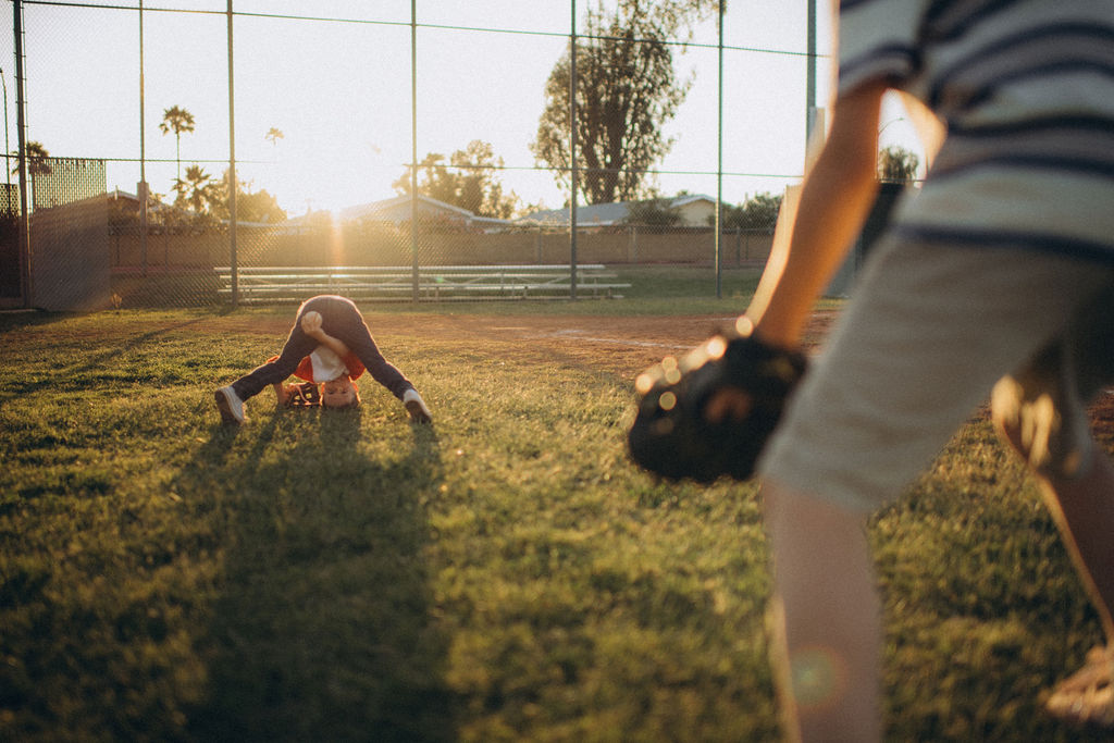 boys being goofy playing catch with a baseball