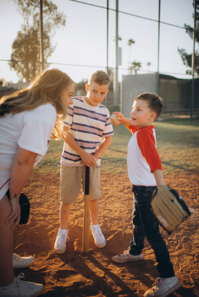 mom and her boys talking at the mound