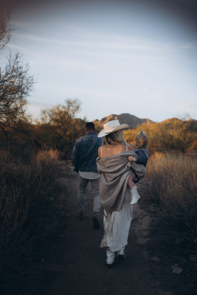 mom walking with her daughter in the scottsdale desert