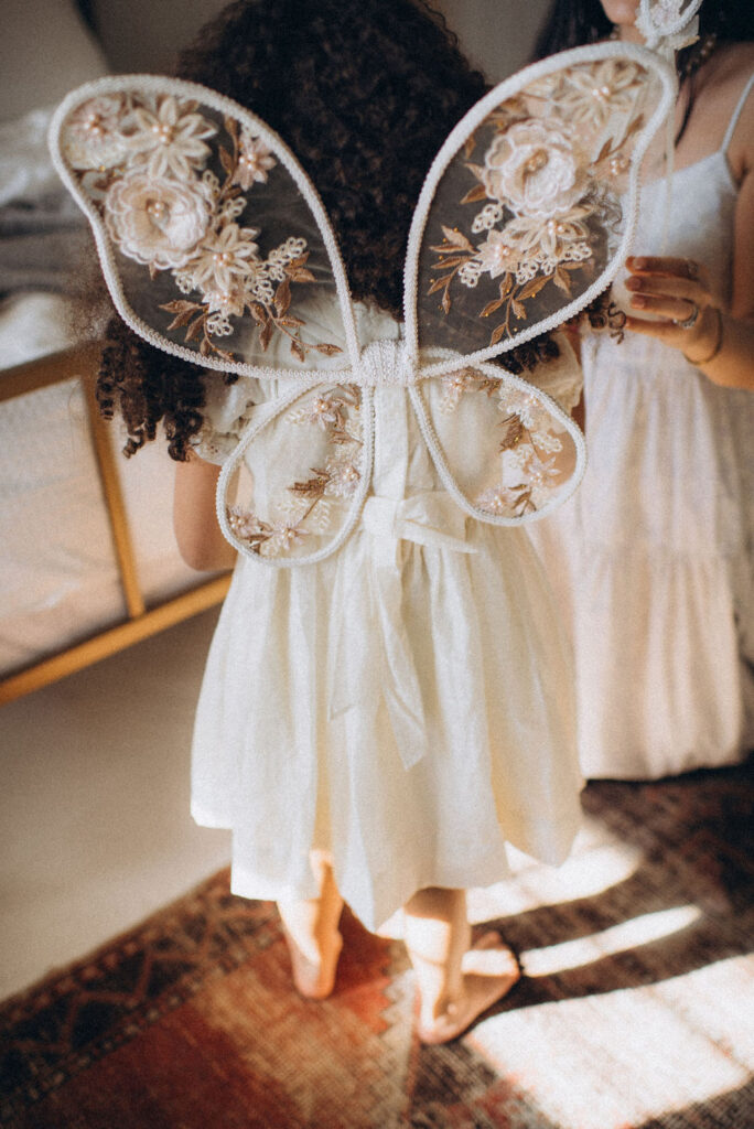 Kid playing dress up at home for an Arizona family photo session